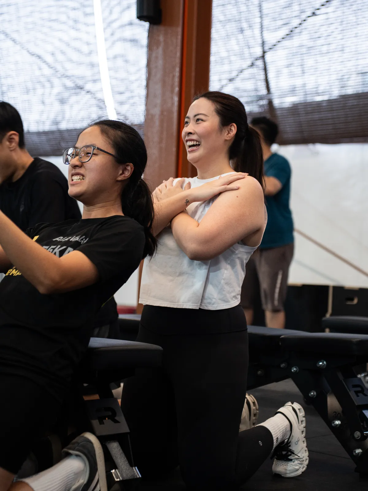 Two members cracking up mid-drill