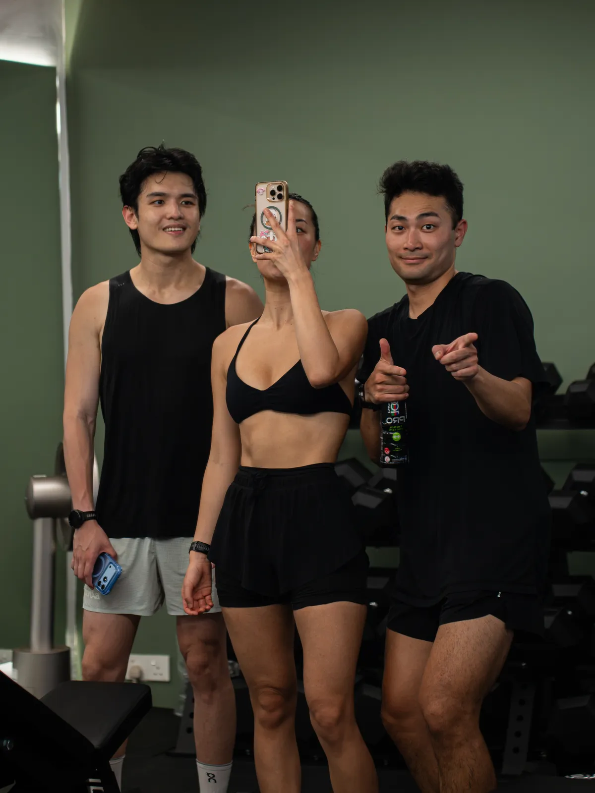 Three friends taking a mirror selfie