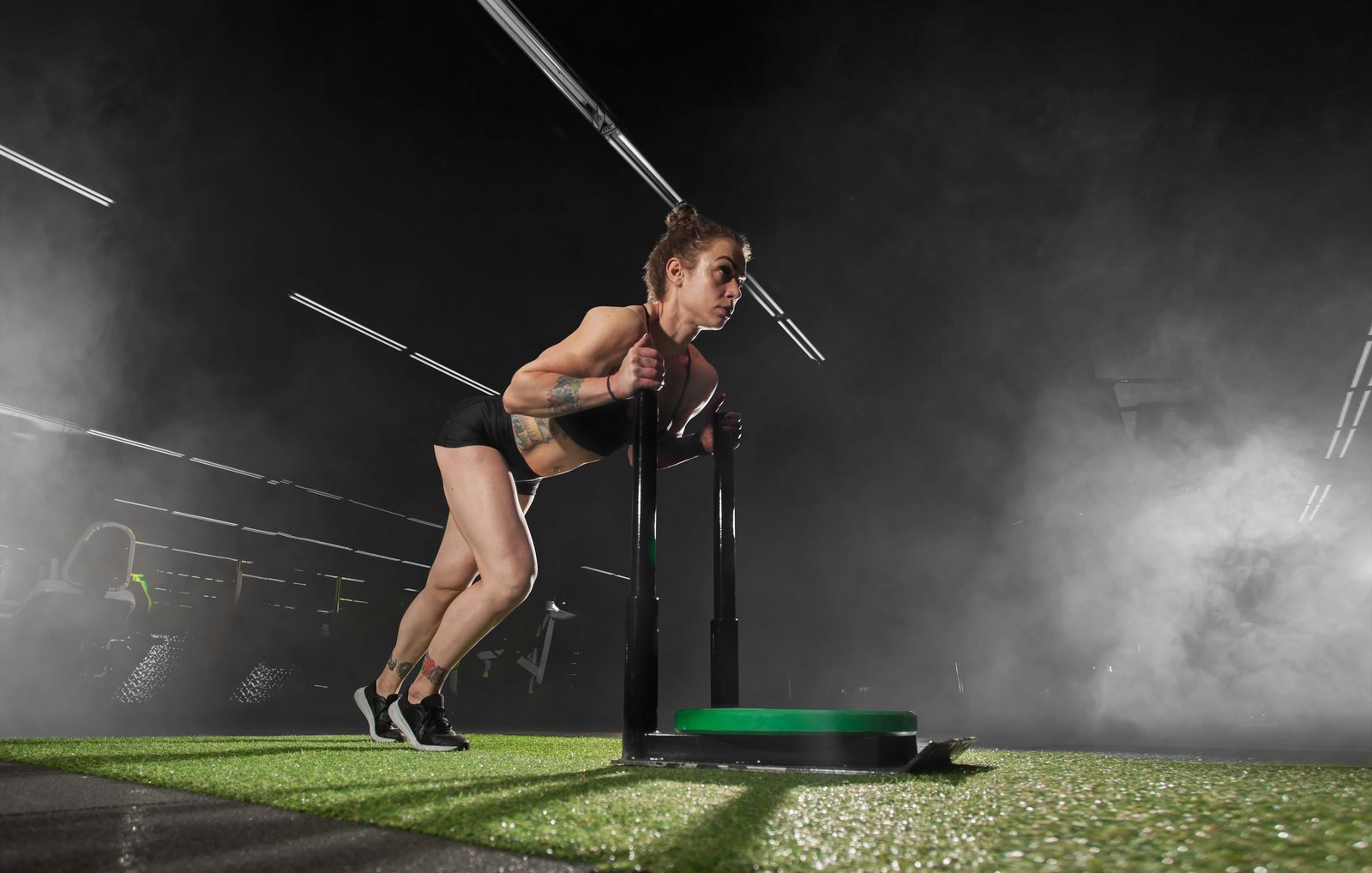 A sled push mid session on the training floor